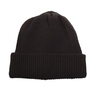 Detail of dark brown knitted beanie featuring thick ribbed texture and wide fold-over cuff