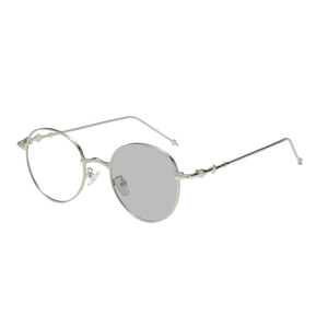 Classic round metal sunglasses with silver frame and geometric temple details in 45-degree view
