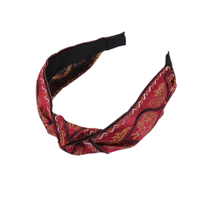 Ethnic embroidered wide headband with red fabric, knotted design and metallic texture
