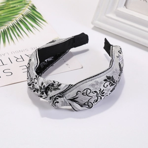 Ethnic style grey brocade knotted headband with intricate floral jacquard pattern for women