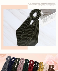 Detailed view of pleated velvet hair scrunchies with long ribbons in multiple colors