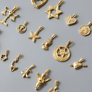 Detailed collection of gold-plated stainless steel star and angel charm pendants