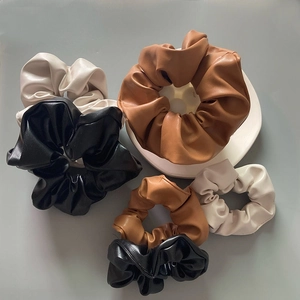 Detailed set of large and small PU leather hair scrunchies in black, brown and beige