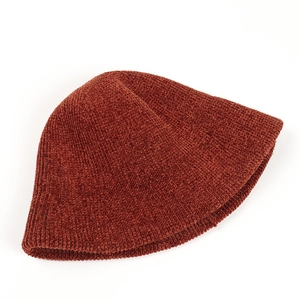 Close-up of rust red chenille knitted bucket hat with thick vertical striped texture