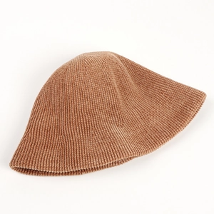 Detailed texture of thick brown chenille bucket hat with vertical ribbing pattern