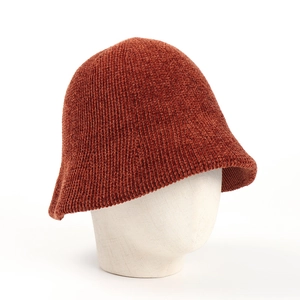 Detailed texture of thick chenille knit on a brick red bucket hat for women