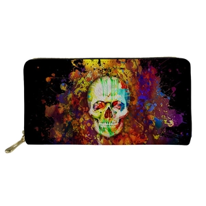Detail of colorful skull graphic on black leather long wallet with golden zipper