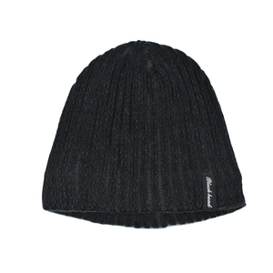 Close-up of black ribbed knit beanie featuring a small Blackhead brand woven label