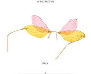Detail view of pink and yellow gradient dragonfly wing sunglasses with metal temples