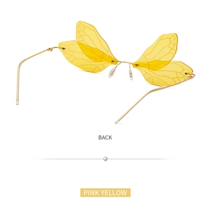 Rear view of pink and yellow dragonfly wing sunglasses with frameless metal hinges