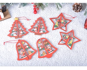 Detailed view of six red wooden Christmas ornaments with snowflake patterns on fur