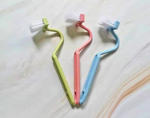 Set of three colorful V-shaped toilet brushes for corner cleaning with long handles