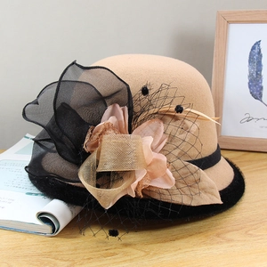Camel wool felt cloche hat featuring black mesh bow and elegant floral decoration