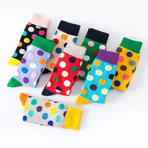 Polka dot cotton crew socks in multiple colors set against a clean white background