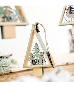 Detail of wooden Christmas star ornament with snowman and pine tree scene and rustic jute rope
