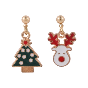 Detail of Christmas stud earrings featuring a green tree and white reindeer design