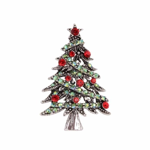 Detail of silver Christmas tree brooch with colorful rhinestones and a red star on top