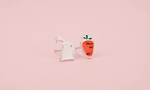 Detailed view of asymmetric S925 silver studs with cute white bunny and orange carrot