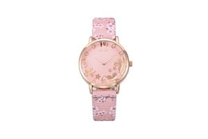 Detail of pink leather watch strap with sakura cherry blossom pattern and gold buckle