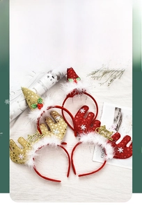 Detail of Christmas headbands with sequins reindeer antlers and Merry Christmas gold lettering