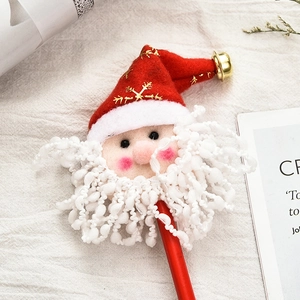 Crayon de Noël rouge avec figurine de Père Noël en peluche et grelot doré