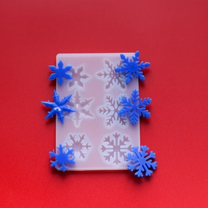 Detailed snowflake silicone mold for DIY resin crafts with six unique winter patterns
