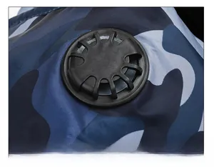 Detail of the black breathing valve on a blue camouflage winter hat for dust protection