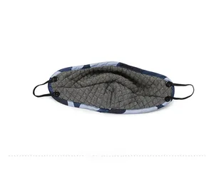 Detail view of the quilted thermal lining and adjustable ear straps on the camo trapper hat