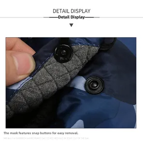 Detail of detachable mask snap button on blue camouflage winter trapper hat