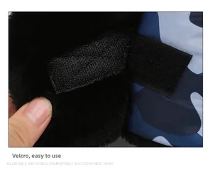 Detail of adjustable velcro strap and plush faux fur lining on camouflage aviator hat