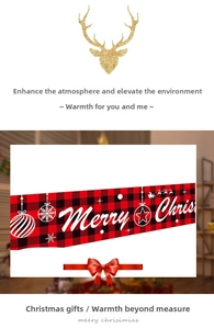 Detail of red and black plaid Christmas banner with Merry Christmas text and deer icon