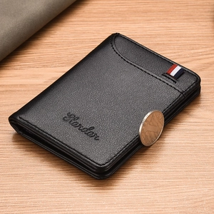 Slim black leather bifold wallet for men with Slandar logo and coin for size reference