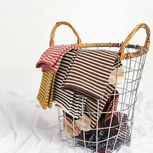 French style striped cotton mid-tube socks in various colors displayed in a basket