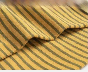 Macro shot of ginger yellow and dark gray striped cotton knit fabric texture on socks