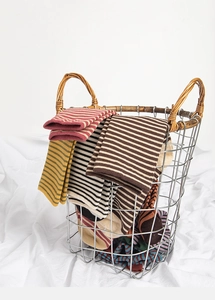 French style striped cotton socks in various colors displayed in a woven metal basket