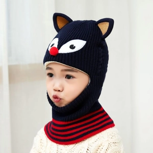 Detail of child's fox knit hood with ear flaps and navy blue fleece lining