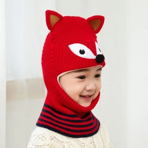Detail of children's knitted red fox hat with integrated scarf and ear protection