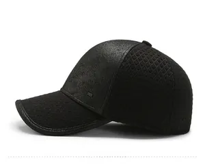 Detail view of winter baseball cap showing black faux leather and quilted fabric texture