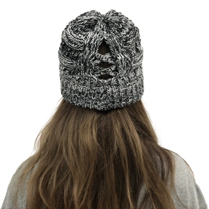 Detail of knit beanie with unique back ponytail hole and cross stripe weaving design