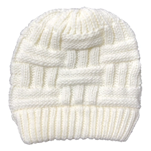 Close-up of off-white chunky knit beanie showing thick wool texture and ribbed cuff