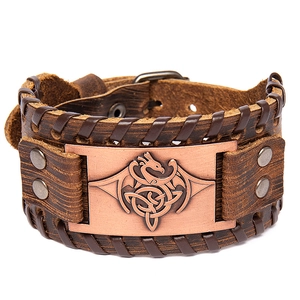 Handmade brown leather bracelet with dragon motif bronze plate and rivet details