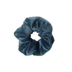 Deep teal velvet scrunchie hair tie with soft glossy texture on white background