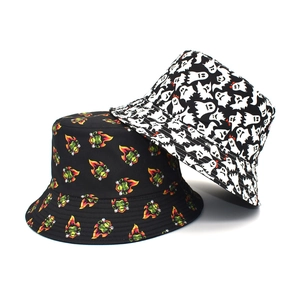 Detail of canvas bucket hats with green flame monkey and black and white ghost prints