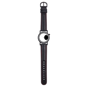 Macro detail of black leather watch strap with contrast red stitching and white dial