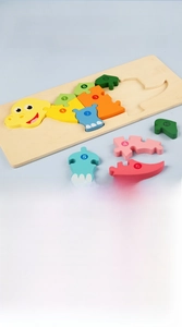 Detailed view of child hand picking up numbered pieces of a 3D wooden dinosaur puzzle