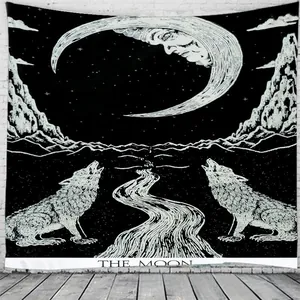 Detail of The Moon tarot tapestry hanging on white brick wall with mystical black and white art