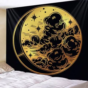 Detail of vintage black and gold tapestry featuring a crescent moon and starry sky