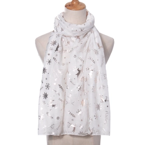 Detail of white Christmas scarf with silver snowflake and reindeer metallic foil prints