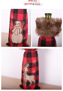 Detail of red and black plaid Christmas wine bottle bags with faux fur and embroidery