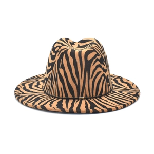 Women's zebra print fedora hat with a wide brim and elegant gold buckle detail
